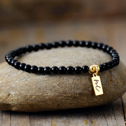 Handmade Black Onyx Beaded Bracelet with a Gold Plated Tag