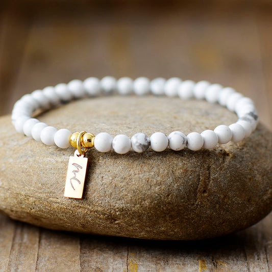 Handmade Natural Howlite Beaded Bracelet with a Gold Plated Tag
