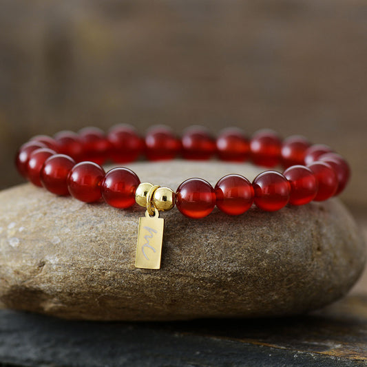 Handmade Carnelian Beaded Bracelet with a Gold Plated Tag