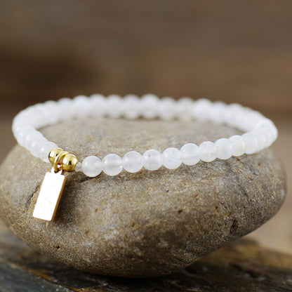 Handmade Moonstone Beaded Bracelet with a Gold Plated Tag